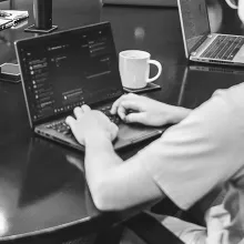 Person typing on laptop