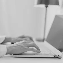 Typing on laptop
